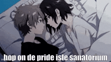 a boy and a girl are kissing in bed .