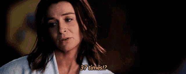 a woman in a white robe is asking 37 times .