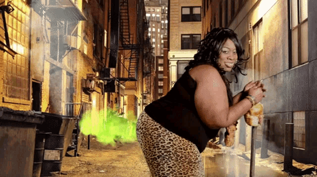 a woman in a black shirt and leopard print pants is farting