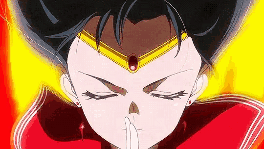 a close up of a cartoon character with her eyes closed and her hand on her mouth .