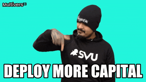 a man with a beard wearing a svu hoodie says deploy more capital