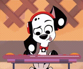 a dalmatian dog wearing headphones sitting at a desk