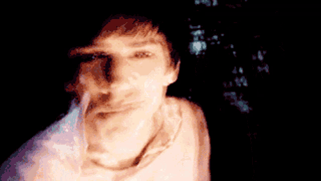 a blurry picture of a person 's face with a blurred background