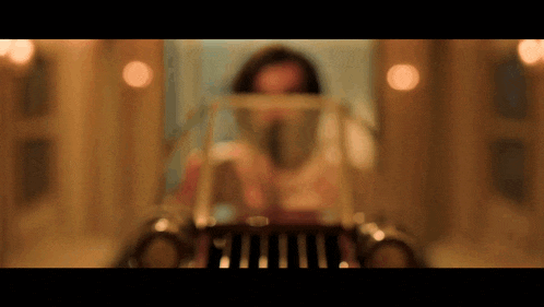 a blurry picture of a woman behind a glass door