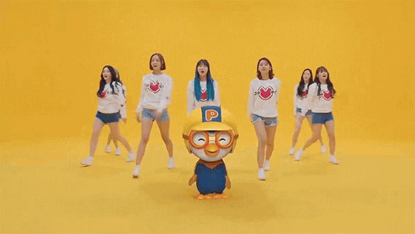 a group of girls are dancing in front of a yellow background that says " banana chaicha "