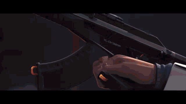 a close up of a person holding a gun .