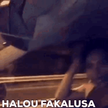 a blurred image of a person with the words halou fakalausa written below them