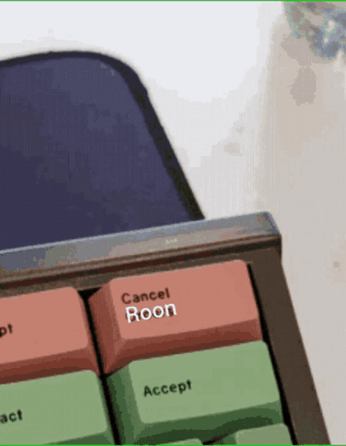 a close up of a keyboard with a cancel roon key