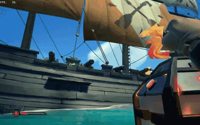 a pirate ship with a flame coming out of the cannon
