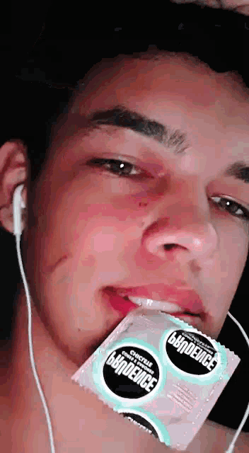 a man with a condom in his mouth that says ' dexrust ' on it