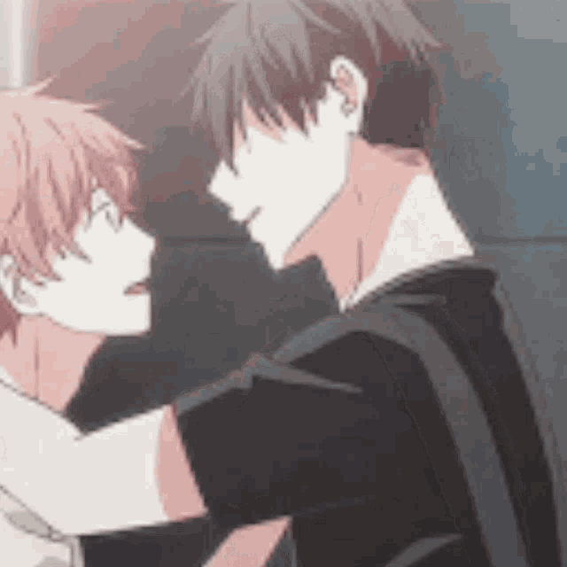 a couple of anime characters standing next to each other and hugging each other .