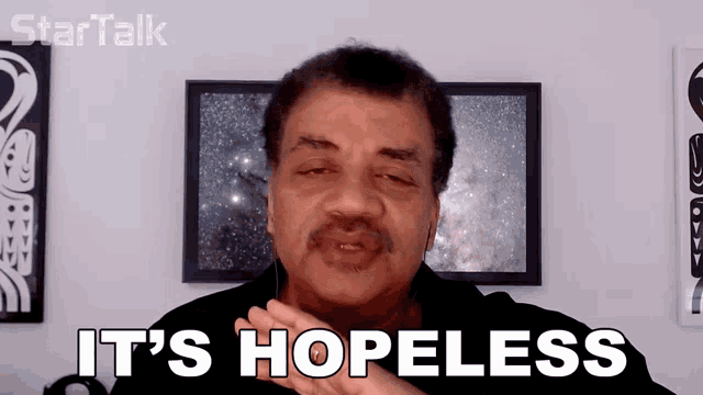 a man with headphones says it 's hopeless