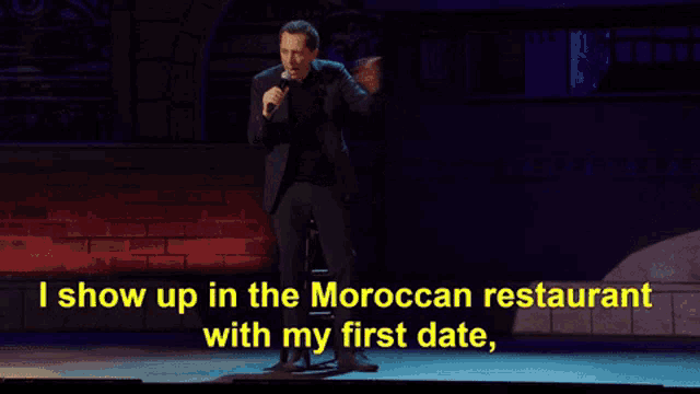 a man speaking into a microphone with the words i show up in the moroccan restaurant with my first date written below him