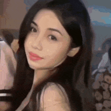 a close up of a woman 's face in a blurry photo