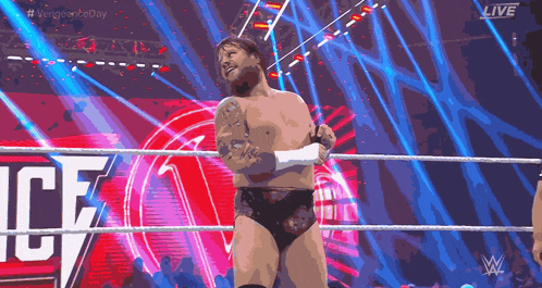 a man in a wrestling ring with the word ice on the screen