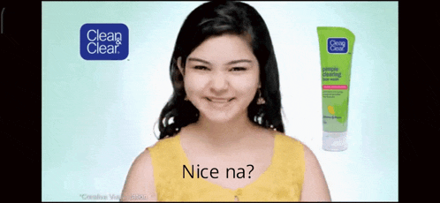 a girl is smiling in front of a clean clear advertisement