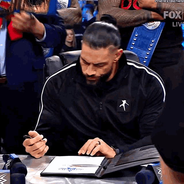 Roman Reigns Signing Contract GIF - Roman Reigns Signing Contract Wwe GIFs