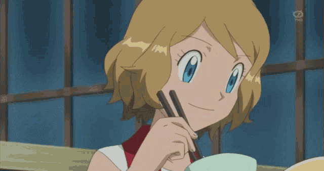 a cartoon girl is eating from a bowl with chopsticks and the tv channel is visible