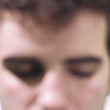 a close up of a person 's face with their eyes closed