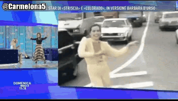 a screen shows a woman dancing in front of cars and says domenica in the bottom right corner