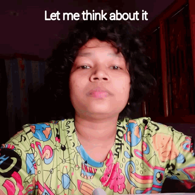 a woman in a colorful shirt with the words let me think about it below her