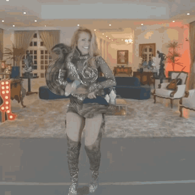 a woman holding a microphone in a living room