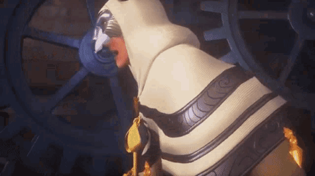 a cartoon character is standing in front of a gear and holding a key .