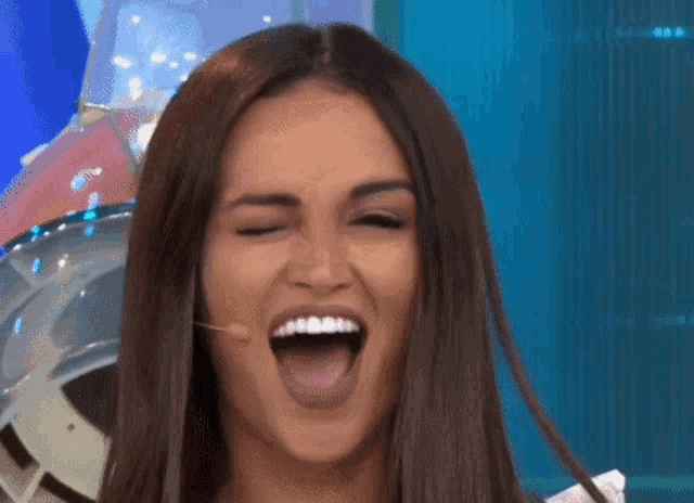 a woman is making a funny face with her tongue sticking out