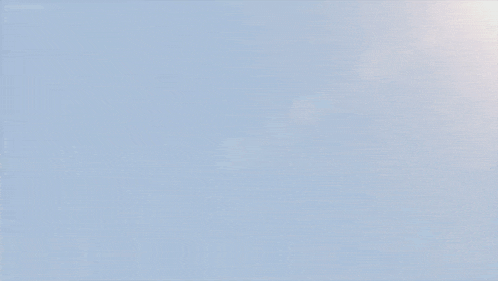 a futuristic fighter jet is flying through a blue sky