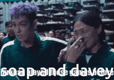 a man with purple hair is standing next to another man with black hair and the words soap and davey