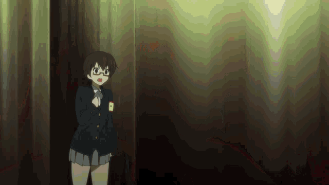 a girl with glasses is standing in a dark room with the letter b on her badge