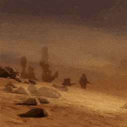 a group of soldiers are running in the desert with guns in their hands .