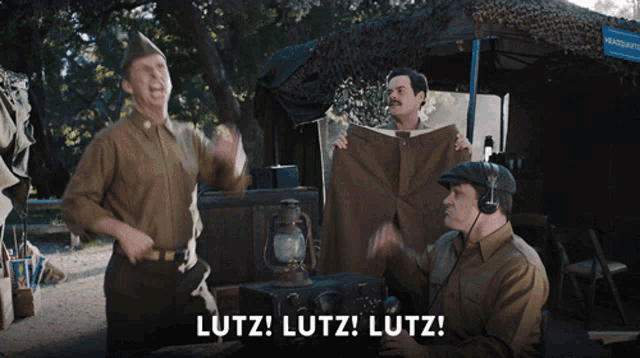 a man in a military uniform says lutz while another man looks on