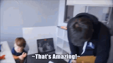 a man says that 's amazing while looking at a laptop