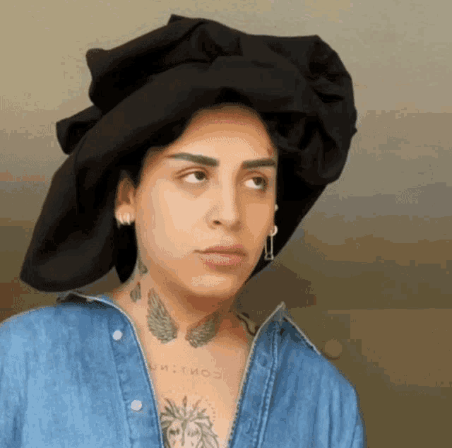 a woman with a tattoo of a lion on her neck