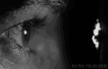 a close up of a woman 's eye with a tear coming out of it .