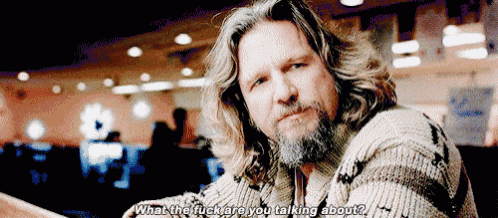 a man with long hair and a beard is talking about something