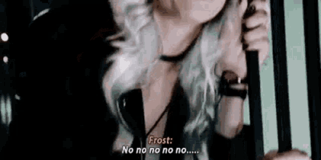 a woman with gray hair is talking on a cell phone .