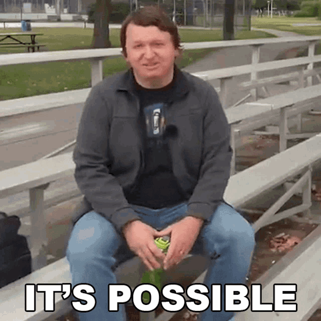 a man is sitting on a bench with the words " it 's possible " written above him
