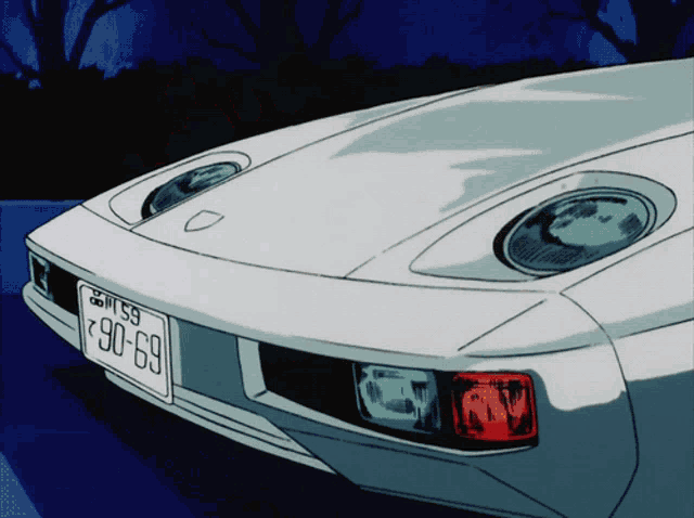 a white car with a license plate that says 90-69