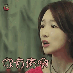 a close up of a woman 's face with a surprised look on her face .