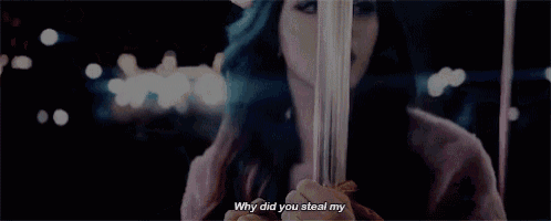a woman with blue hair is standing on a pole and says why did you steal my .