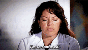 a woman in a lab coat says " i 'm so confused " with her eyes closed