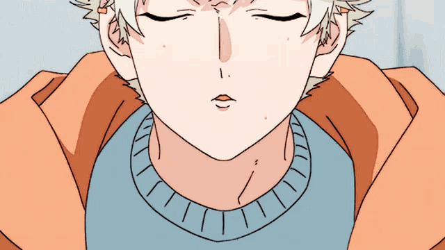 a close up of a person 's face with a sweater on