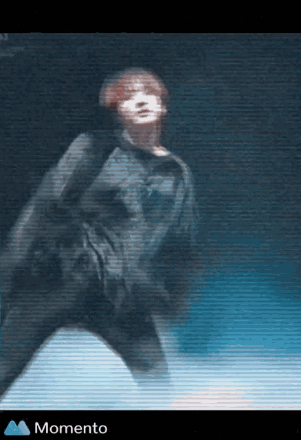 a blurry picture of a person with the word momento at the top