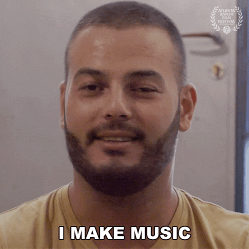 a man with a beard says " i make music "