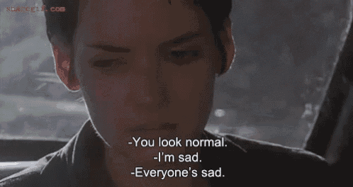 a close up of a person 's face with the words " you look normal i 'm sad everyone 's sad " written below