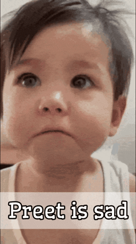 a baby with a sad look on his face and the words preet is sad