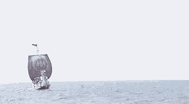 a boat is floating on top of a body of water .