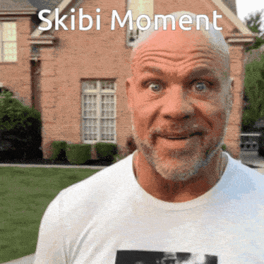 a bald man with a beard wearing a skibi moment t-shirt